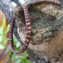 Upper arm macrame bangle with feathers Brown.