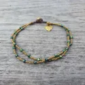 Boho anklet made of antique golden crystal beads in green and brass.