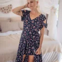 Cut out dress asymmetrical knee length with flowers in dark blue rose print